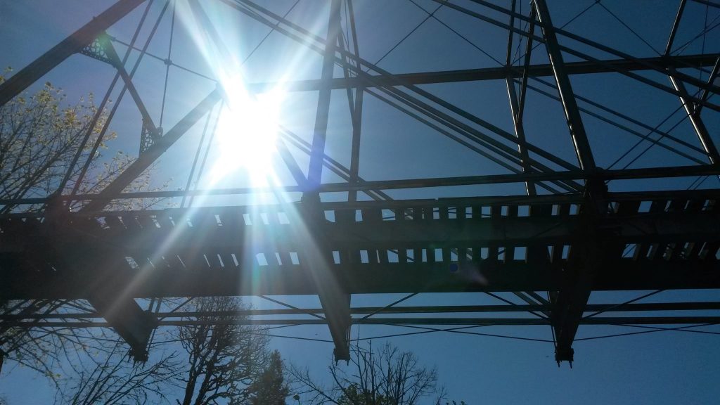 Sunlight through the iron lattice of Hayden Bridge
